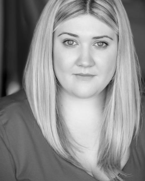 Black and white headshot of Caitlin Mckee