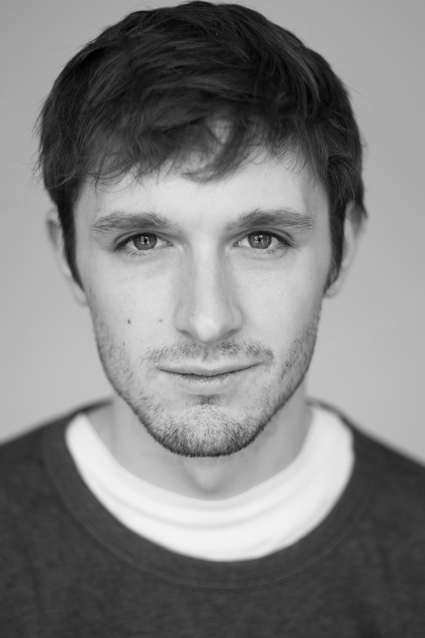 Black and white headshot of Peter Mooney