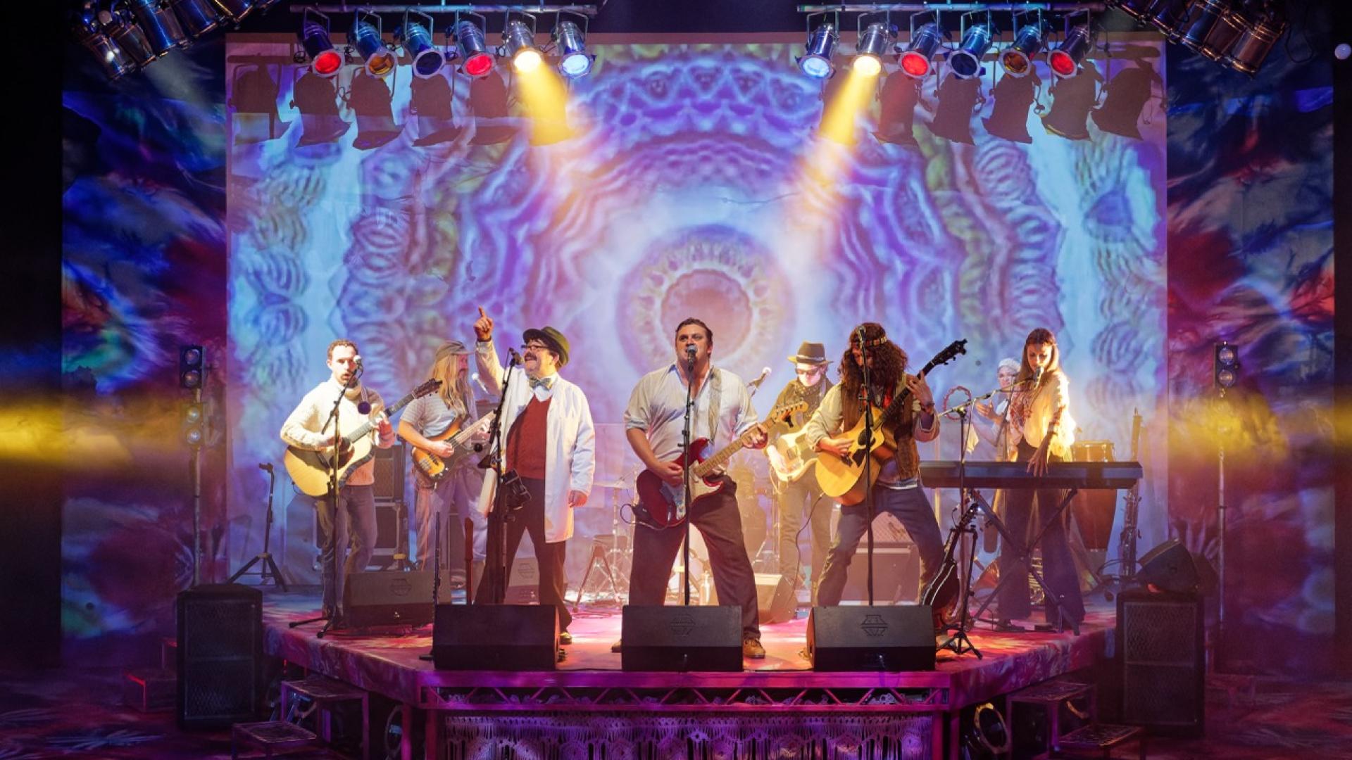 7 of the Operation Julie cast on stage playing instruments
