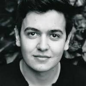 Black and white headshot of Tom Connor