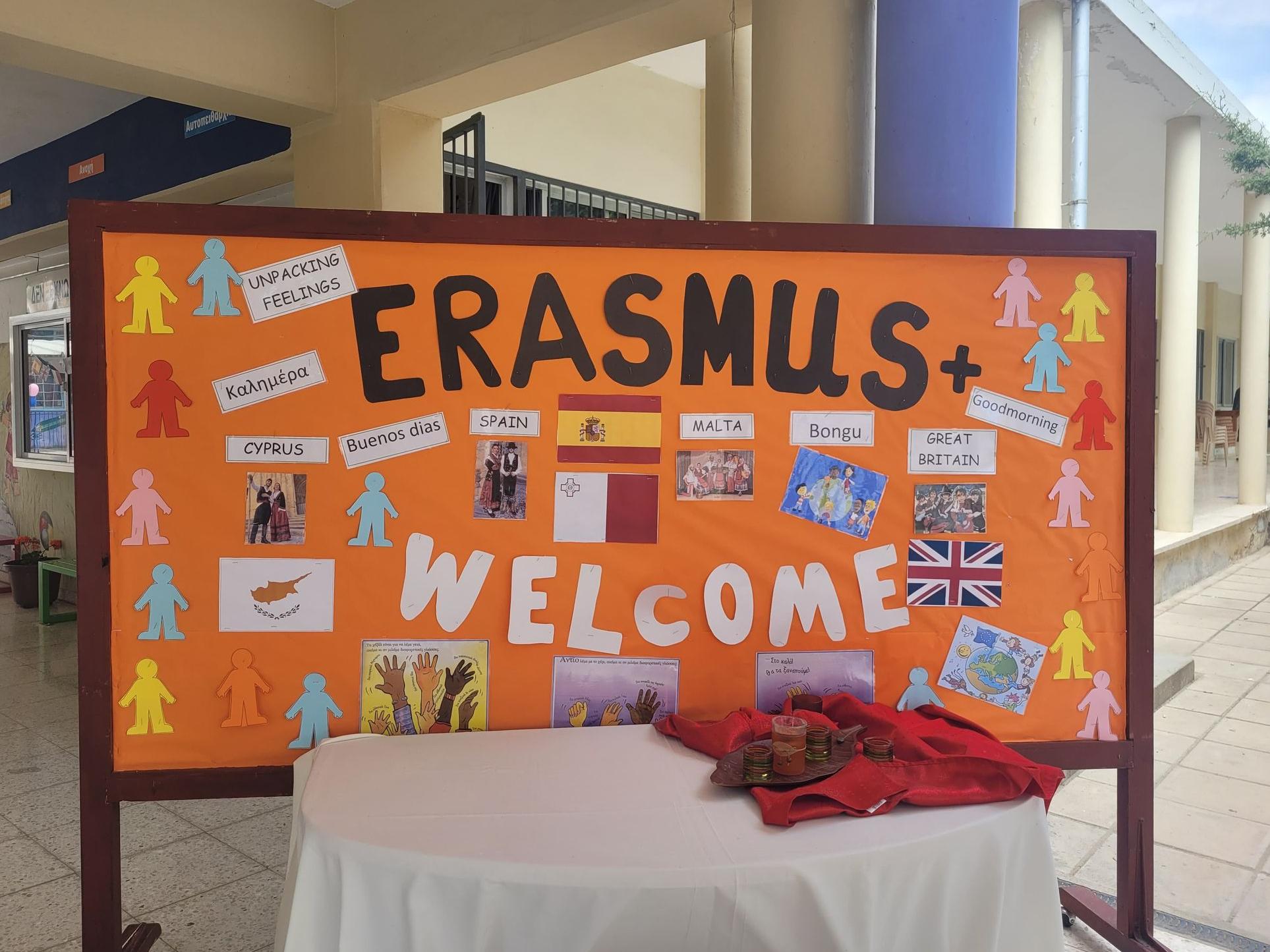 An orange display board that says 'Erasmus Welcome' with Spanish, Maltese, British and Cyprus flags.